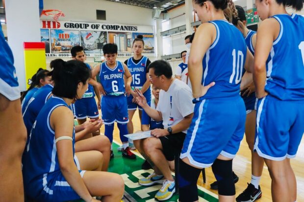 National team coach Pat Aquino and the Gilas Pilipinas Women.