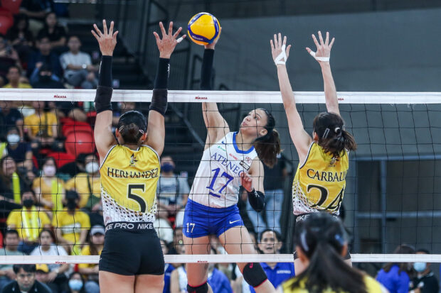 UST's Imee Hernandez (left) goes up to block an attempt from Ateneo's Faith Nisperos. –MARLO CUETO/INQUIRER.net
