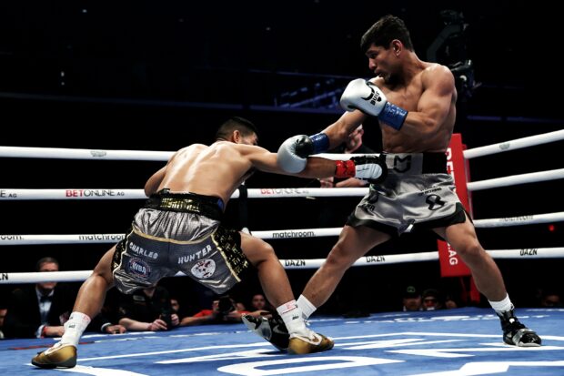 Marlon Tapales, left, targets the body of during their super bantamweight title fight in San Antonio, Texas, USA.