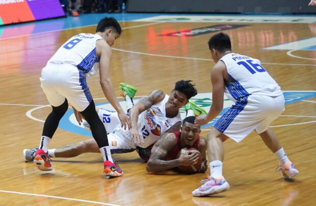Jamie Malonzo (with ball) and the rest of the GinKings overcome all that the Tropang Giga could offer to regain control of the series.