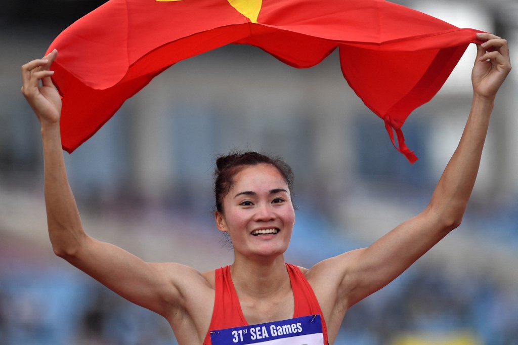 Vietnam's Quach Thi Lan celebrates winning gold in the women's 400m hurdles final during the 31st Southeast Asian Games (SEA Games) in My Dinh National Stadium, Hanoi on May 17, 2022. 