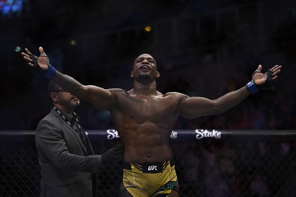Brazilian Jailton Almeida celebrates after defeating Russian Shamil Abdurakhimov during their heavyweight bout at the Ultimate Fighting Championship (UFC) event at the Jeunesse Arena in Rio de Janeiro, Brazil, on January 21, 2023. 