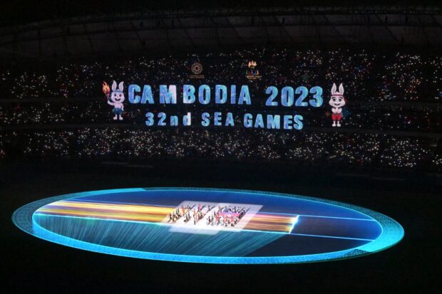 The national flag of Cambodia is brought into the Morodok Techo National Stadium at the start of the opening ceremony of the 32nd Southeast Asian Games (SEA Games) in Phnom Penh on May 5, 2023.