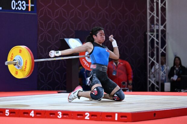 Philippines' Lovely Vidal Inan competes in the women's 49kg weightlifting event during the 32nd Southeast Asian Games (SEA Games) in Phnom Penh on May 13, 2023.
