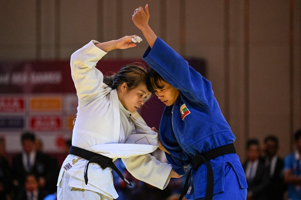 a Furukawa (L) competes against Myanmar's Chu Myat Now Wai (R) in their women's -57kg judo final event during the 32nd Southeast Asian Games (SEA Games) in Phnom Penh on May 14, 2023. 