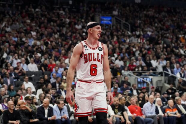 Alex Caruso #6 of the Chicago Bulls reacts against the Toronto Raptors during the 2023 Play-In Tournament at the Scotiabank Arena on April 12, 2023 in Toronto, Ontario, Canada.