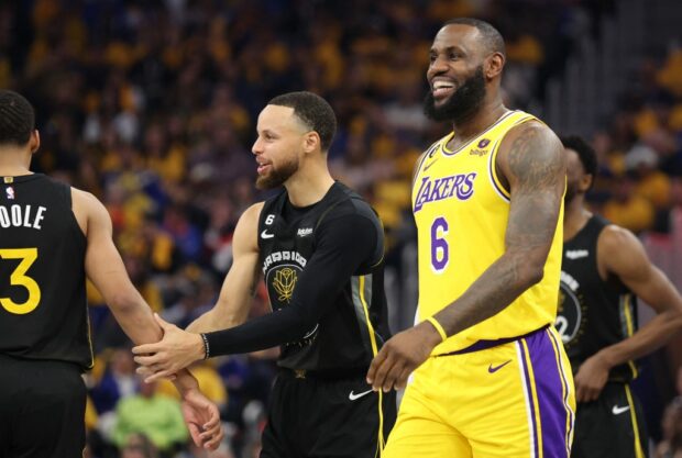 Stephen Curry #30 of the Golden State Warriors and LeBron James #6 of the Los Angeles Lakers react during the first quarter in game one of the Western Conference Semifinal Playoffs at Chase Center on May 02, 2023 in San Francisco, California.