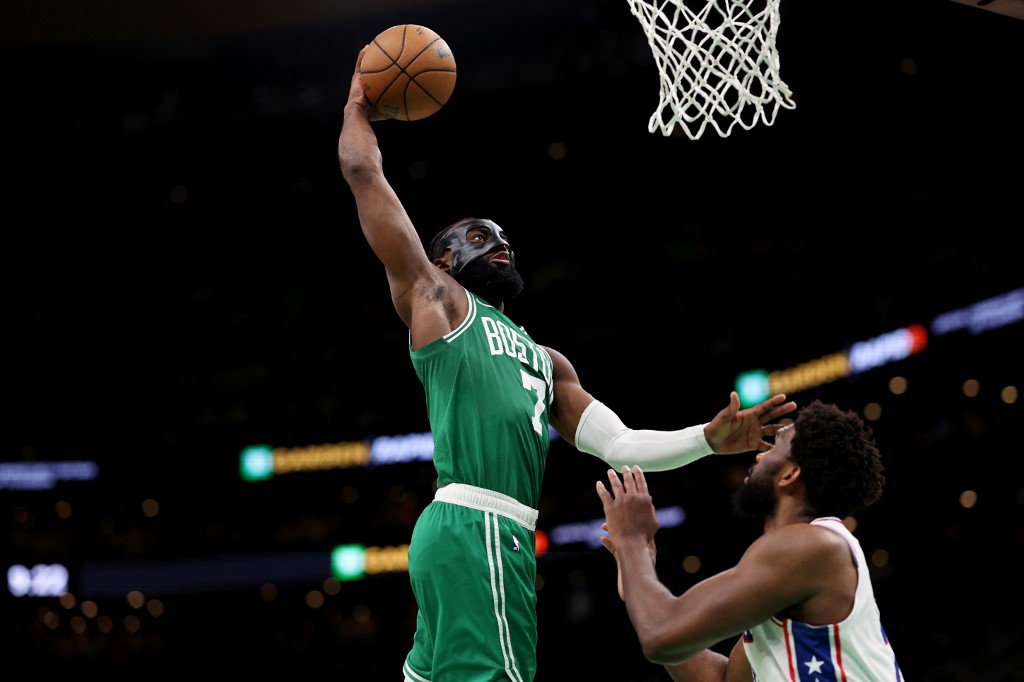 NBA: Jaylen Brown #7 of the Boston Celtics dunks the ball over Joel Embiid #21 of the Philadelphia 76ers during the second half of game two of the Eastern Conference Second Round Playoffs at TD Garden on May 03, 2023 in Boston, Massachusetts.  the 