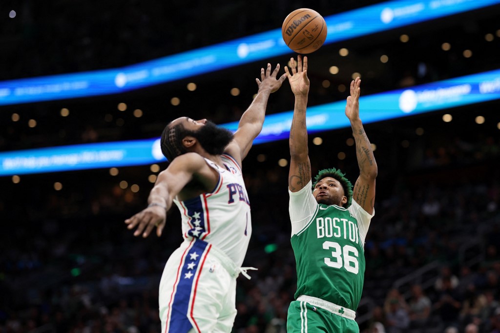   Marcus Smart #36 of the Boston Celtics takes a shot against James Harden #1 of the Philadelphia 76ers during the second half of game two of the Eastern Conference Second Round Playoffs at TD Garden on May 03, 2023 in Boston, Massachusetts. 