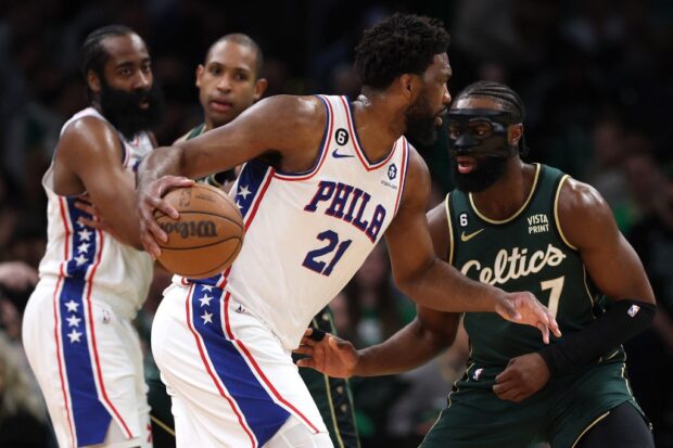  Joel Embiid #21 of the Philadelphia 76ers dribbles against Jaylen Brown #7 of the Boston Celtics during the first quarter of game five of the Eastern Conference Second Round Playoffs at TD Garden on May 09, 2023 in Boston, Massachusetts