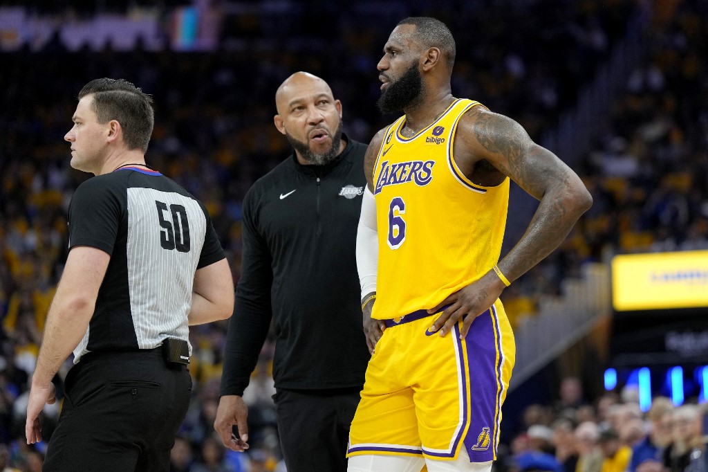 LeBron James #6 of the Los Angeles Lakers talks to head coach Darvin Ham during the second quarterback against the Golden State Warriors in game five of the Western Conference Semifinal Playoffs at Chase Center on May 10, 2023 in San Francisco, California.