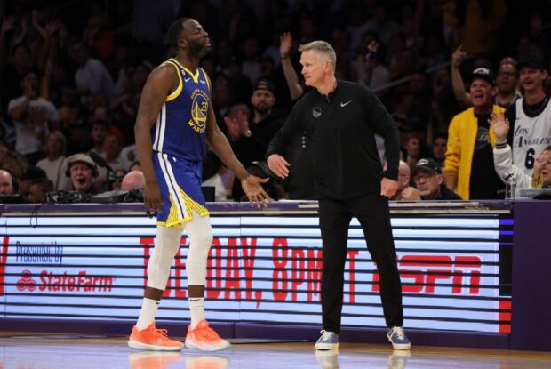 Draymond Green #23 of the Golden State Warriors high fives head coach Steve Kerr during the fourth quarter against the Los Angeles Lakers in game six of the Western Conference Semifinal Playoffs at Crypto.com Arena on May 12, 2023 in Los Angeles, California. 