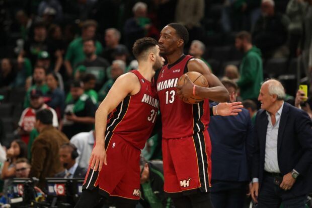   Max Strus #31 speaks with Bam Adebayo #13 of the Miami Heat after defeating the Boston Celtics in game one of the Eastern Conference Finals at TD Garden on May 17, 2023 in Boston, Massachusetts.  The Heat defeated the Celtics 123-116. 