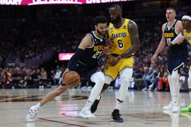 Jamal Murray #27 of the Denver Nuggets drives against LeBron James #6 of the Los Angeles Lakers during the third quarter in game two of the Western Conference Finals at Ball Arena on May 18, 2023 in Denver, Colorado. 