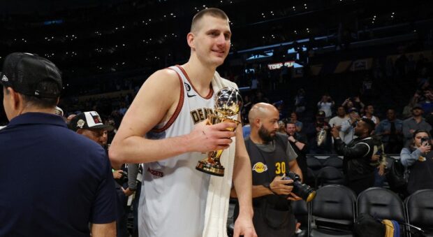 Nikola Jokic #15 of the Denver Nuggets celebrates with the Most Valuable Player trophy following the game four and series victory against the Los Angeles Lakers in the Western Conference Finals at Crypto.com Arena on May 22, 2023 in Los Angeles, California.