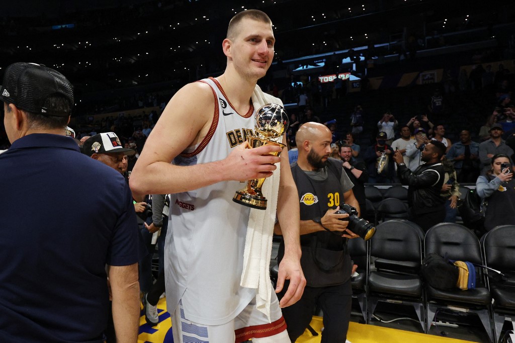 Nikola Jokic #15 of the Denver Nuggets celebrates with the Most Valuable Player trophy following the game four and series victory against the Los Angeles Lakers in the Western Conference Finals at Crypto.com Arena on May 22, 2023 in Los Angeles, California. 