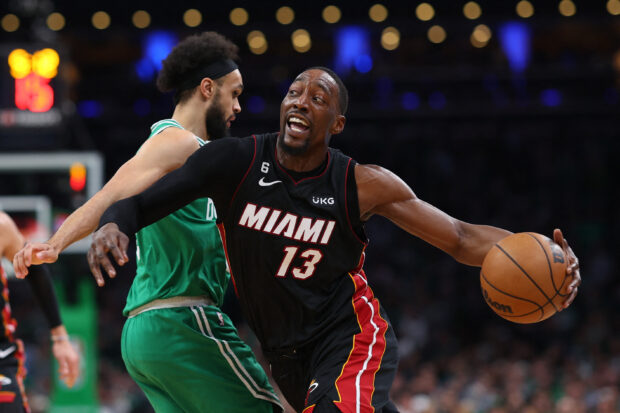 Miami Heat's Bam Adebayo #13 drives around Derrick White #9 of the Boston Celtics during the first round of game 5 of the Eastern Conference Finals at TD Garden on May 25, 2023 in Boston, Massachusetts.  NOTE TO USERS: The User explicitly acknowledges and agrees that, by downloading and or using this photograph, the User is agreeing to the terms and conditions of the Getty Images License Agreement.  Maddie Meyer/Getty Images/AFP (Photo by Maddie Meyer/GETTY IMAGES NORTH AMERICA/Getty Images via AFP)
