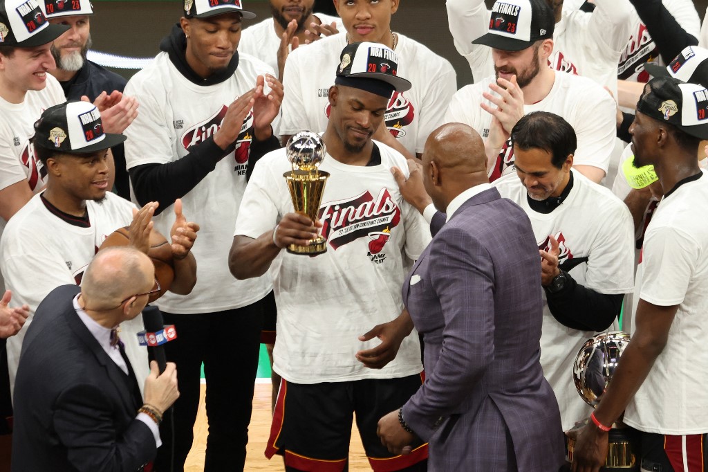 Alonzo Mourning presents Jimmy Butler #22 of the Miami Heat with the Larry Bird Trophy after Butler was named the Eastern Conference Finals MVP after defeating the Boston Celtics 103-84 in game seven of the Eastern Conference Finals at TD Garden on May 29, 2023 in Boston, Massachusetts.