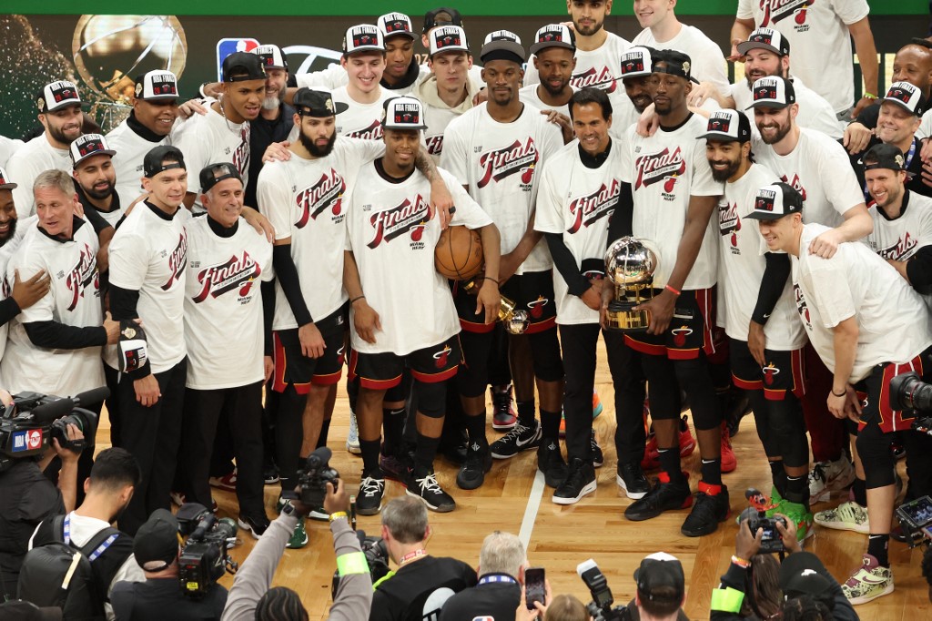 The Miami Heat pose with the Bob Cousy Trophy after defeating the Boston Celtics 103-84 in game seven of the Eastern Conference Finals at TD Garden on May 29, 2023 in Boston, Massachusetts.