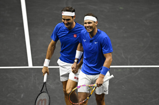 FILE PHOTO: Tennis - Laver Cup - 02 Arena, London, Britain - September 24, 2022 Team Europe's Rafael Nadal and Roger Federer during their doubles match against Team World's Jack Sock and Frances Tiafoe 