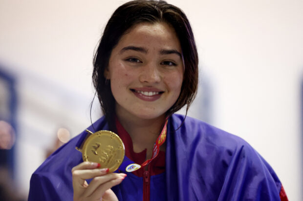 Southeast Asian Games - Swimming - Morodok Techo National Aquatics Centre, Phnom Penh, Cambodia - May 9, 2023 Philippines' Teia Isabella Dunlap Salvino poses with the gold medal after winning the women's 100m Backstroke fina