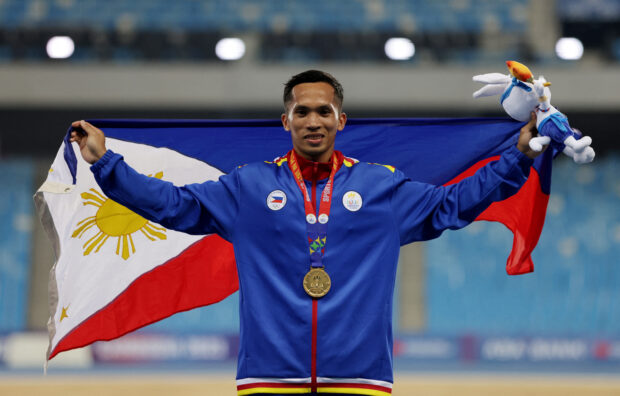 Southeast Asian Games - Athletics - Morodok Techo National Stadium, Phnom Penh, Cambodia - May 9, 2023  Philippines' Janry Ubas celebrates with his gold medal after winning the men's long jump 