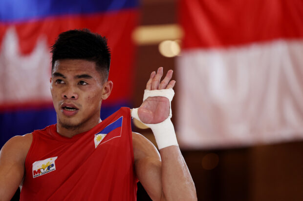 oy Changvar Convention Centre Hall G, Phnom Penh, Cambodia - May 14, 2023 Philippines' Carlo Cano Paalam reacts after winning gold against Indonesia's Aldoms Suguro in the 54kg category 