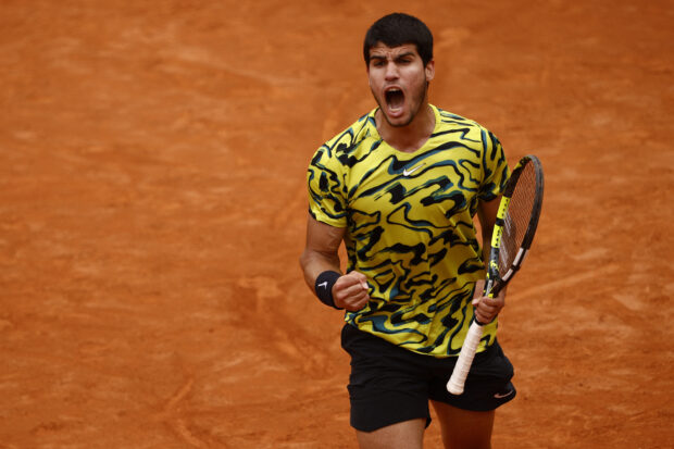 FILE PHOTO: Tennis - Italian Open - Foro Italico, Rome, Italy - May 15, 2023 Spain's Carlos Alcaraz reacts during his round of 32 match against Hungary's Fabian Marozsan 
