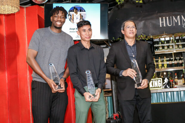 Rhenz Abando (middle) receives his award give by the Collegiate Press Corps on Monday.
