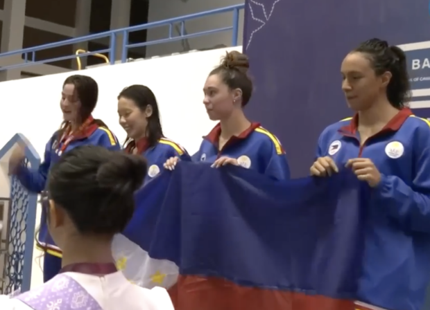 The Philippine women's 4x100 freestyle relay team receiving their bronze medal. 