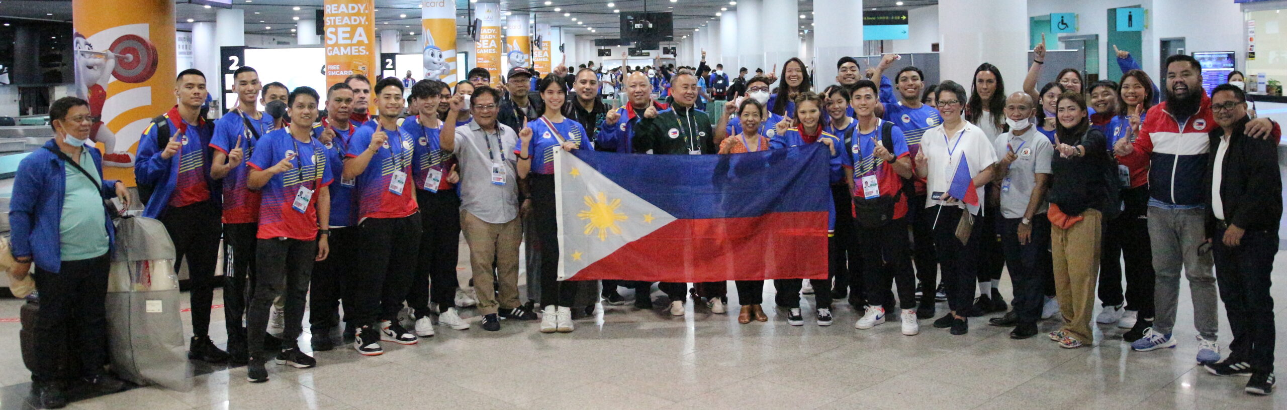 A handful of members of the Philippine delegation, led by Philippine Olympic Committee president Bambol Tolentino (center) is welcomed by the Southeast Asian Games federation at Phnom Penh International Airport on Wednesday.