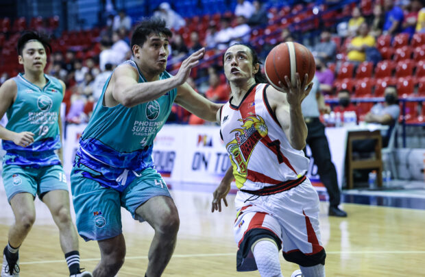 Terrence Romeo (with ball) goes for two of his 27 points against Phoenix center Raul Soyud.