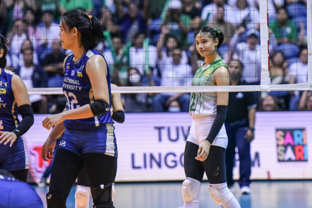 Angel Canino cheekily smiles at her opponents during Game 1 of the UAAP women's volleyball finals. –UAAP PHOTO
