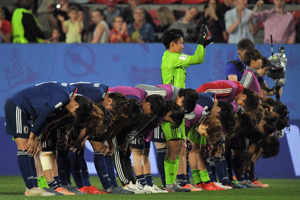 Japan's players acknowledge their supporters at the end of the France 2019 Women's World Cup round of sixteen football match between Netherlands and Japan, on June 25, 2019, at the Roazhon Park stadium in Rennes, north western France.