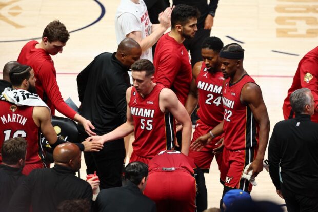 Miami Heat players react during a timeout during the second quarter against the Denver Nuggets in Game One of the 2023 NBA Finals at Ball Arena on June 01, 2023 in Denver, Colorado. 