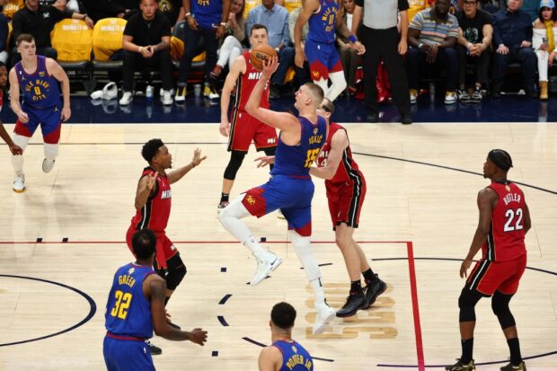 Nikola Jokic #15 of the Denver Nuggets shoots the ball over Kyle Lowry #7 of the Miami Heat during the third quarter in Game One of the 2023 NBA Finals at Ball Arena on June 01, 2023 in Denver, Colorado.