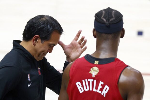 Miami Heat coach Erik Spoelstra and Jimmy Butler.