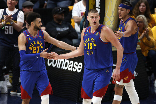 Jun 1, 2023; Denver, CO, USA; Denver Nuggets center Nikola Jokic (15) and guard Jamal Murray (27) celebrate during the second half against the Miami Heat in game one of the 2023 NBA Finals at Ball Arena. 