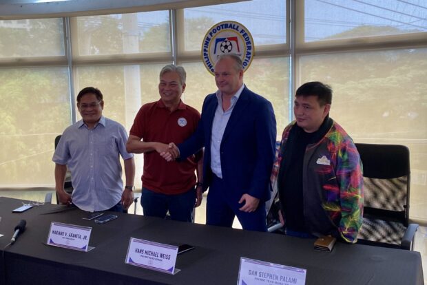 Hans Michael Weiss along with PFF and Azkals executives during a press conference.