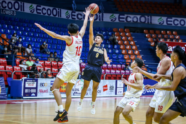 Shawn Argente puts up a shot against San Beda Red Lions defenders.