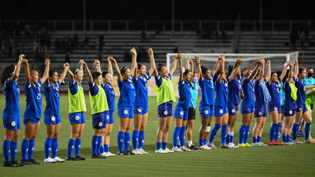 This photo taken on July 15, 2022 shows members of the Philippine women’s footbal team acknowledging the crowd during the women’s Asian Footbal Federation semi-final match at Rizal memorial stadium in Manila. On Friday, July 21, Filipinas will begin its historic maiden campaign in football’s biggest stage–the Fifa Women’s World Cup 2023- in New Zealand.