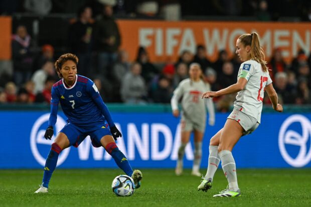 The Philippines’ Sarina Bolden (left) tries to fifind a way past Switzerland’s Lia Walti. —AFP