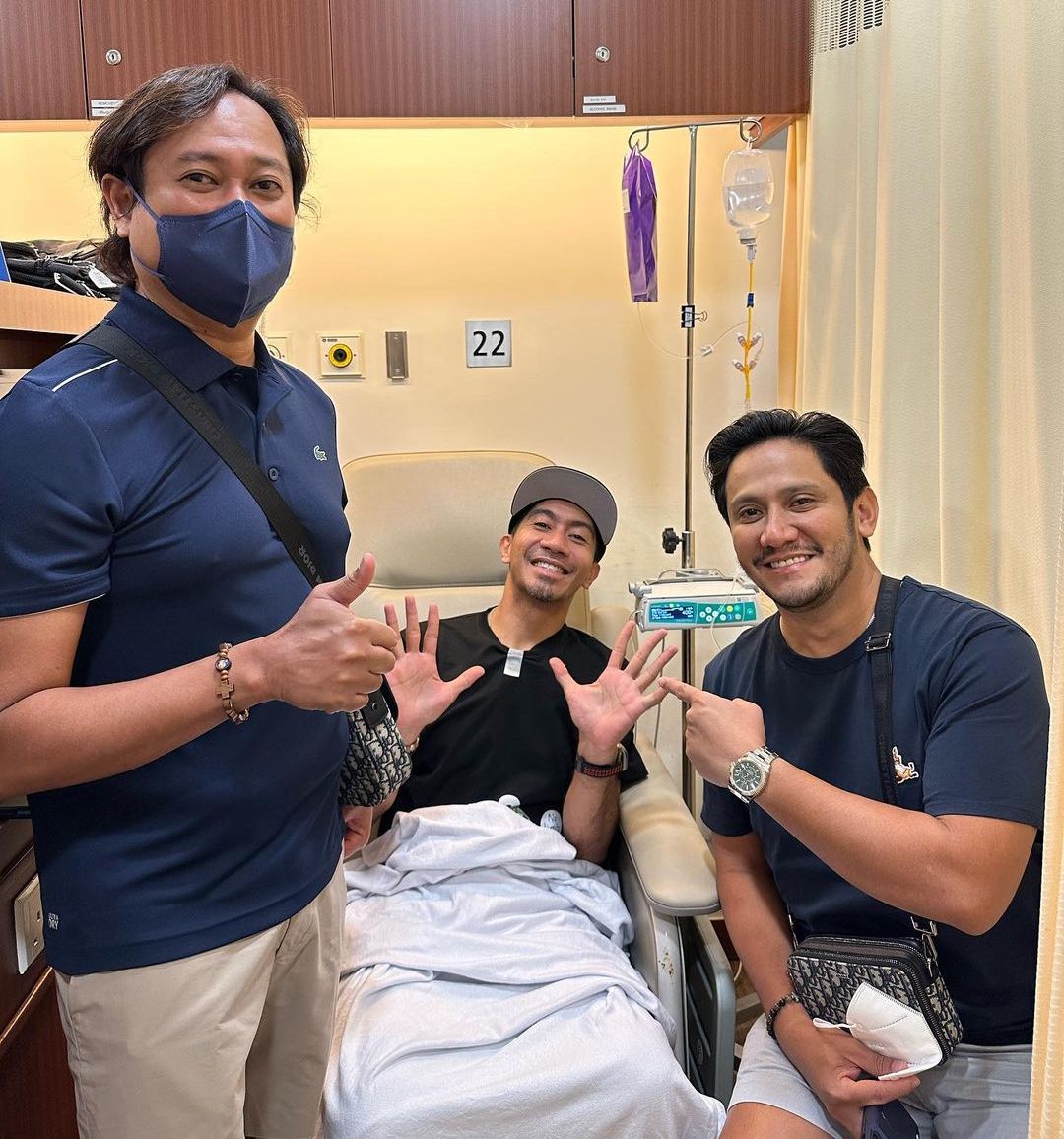 LA Tenorio (center) is accompanied by his close friends during his chemotherapy session in Singapore.