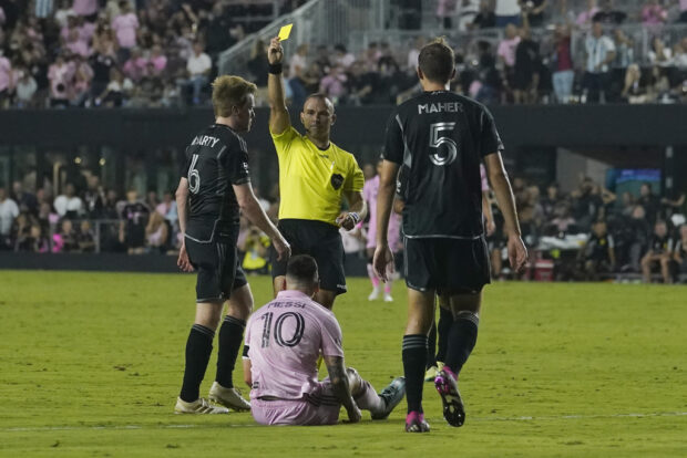 Nashville SC midfielder Dax McCarty (6) draws a yellow card after colliding with Inter Miami forward Lionel Mess