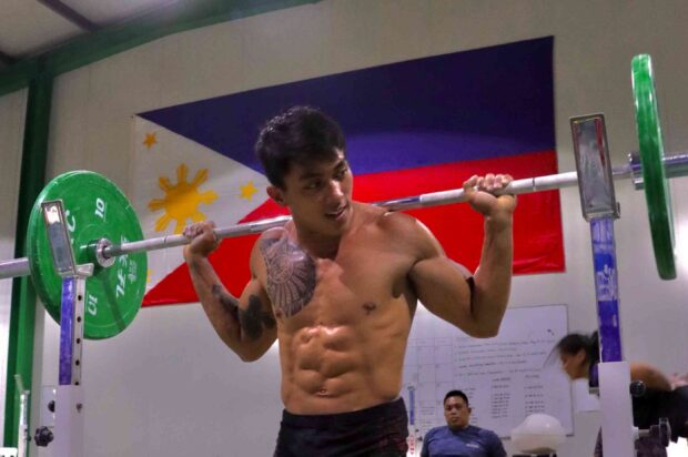 John Febuar Ceniza works out at the Hidilyn Diaz Weightlifting Gym inside the Rizal Memorial Sports Complex. —FILE PHOTO
