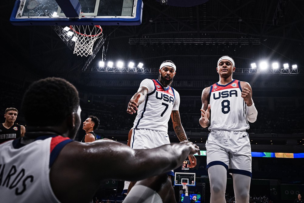 Team USA's Brandon Ingram and Paolo Banchero gestures to help Anthony Edwards in a Fiba World Cup game.