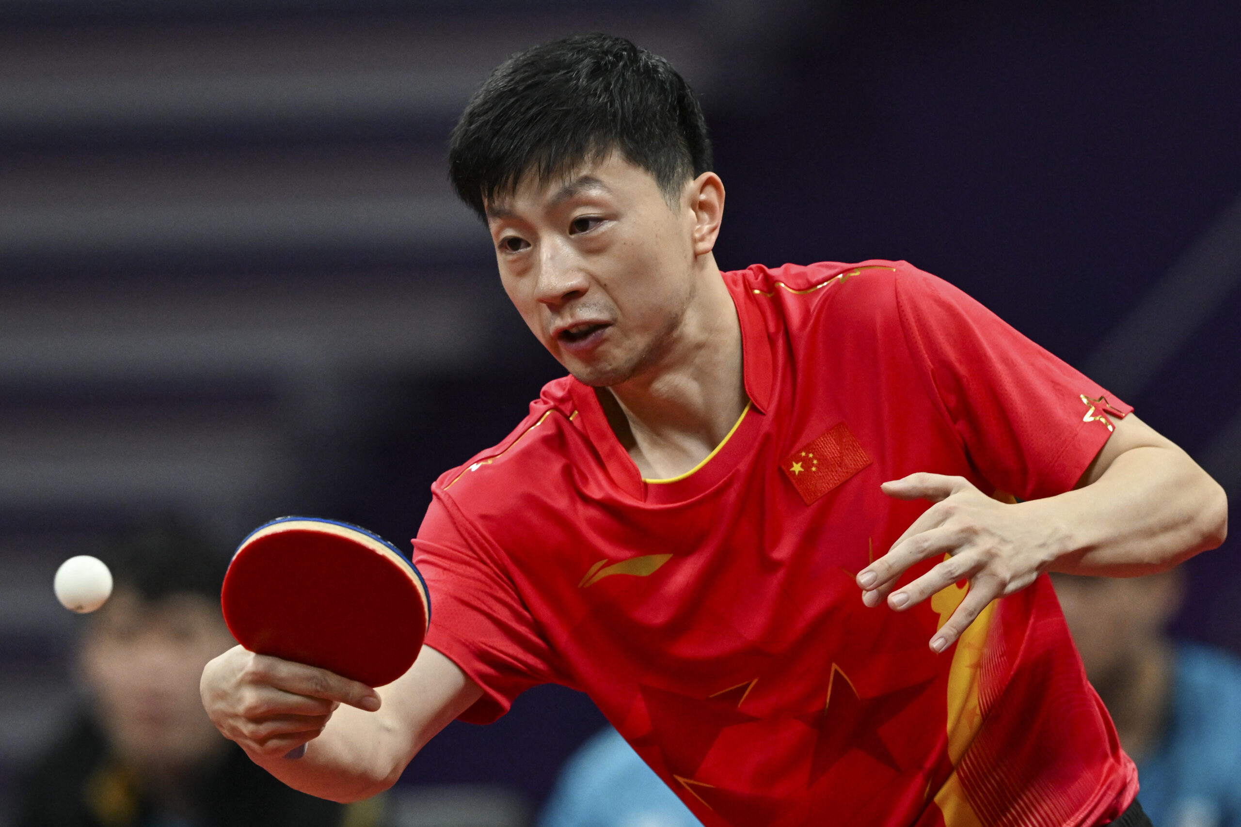 China's Ma Long hits a return against South Korea's Park Ganghyeon in their men's team final table tennis match during the Hangzhou 2022 Asian Games 