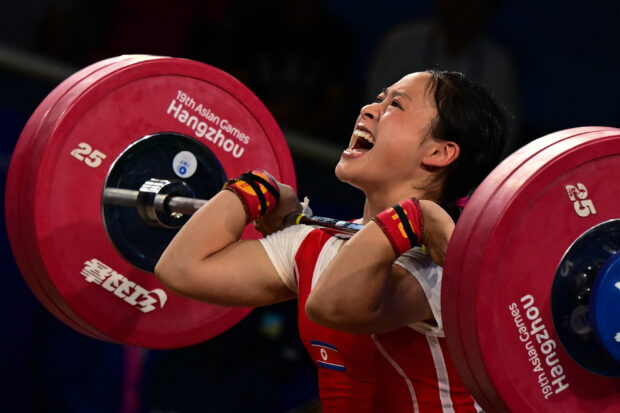 North Korea's Ri Song Gum competes in the womens 49kg weightlifting competition during the 2022 Asian Games in Hangzhou,