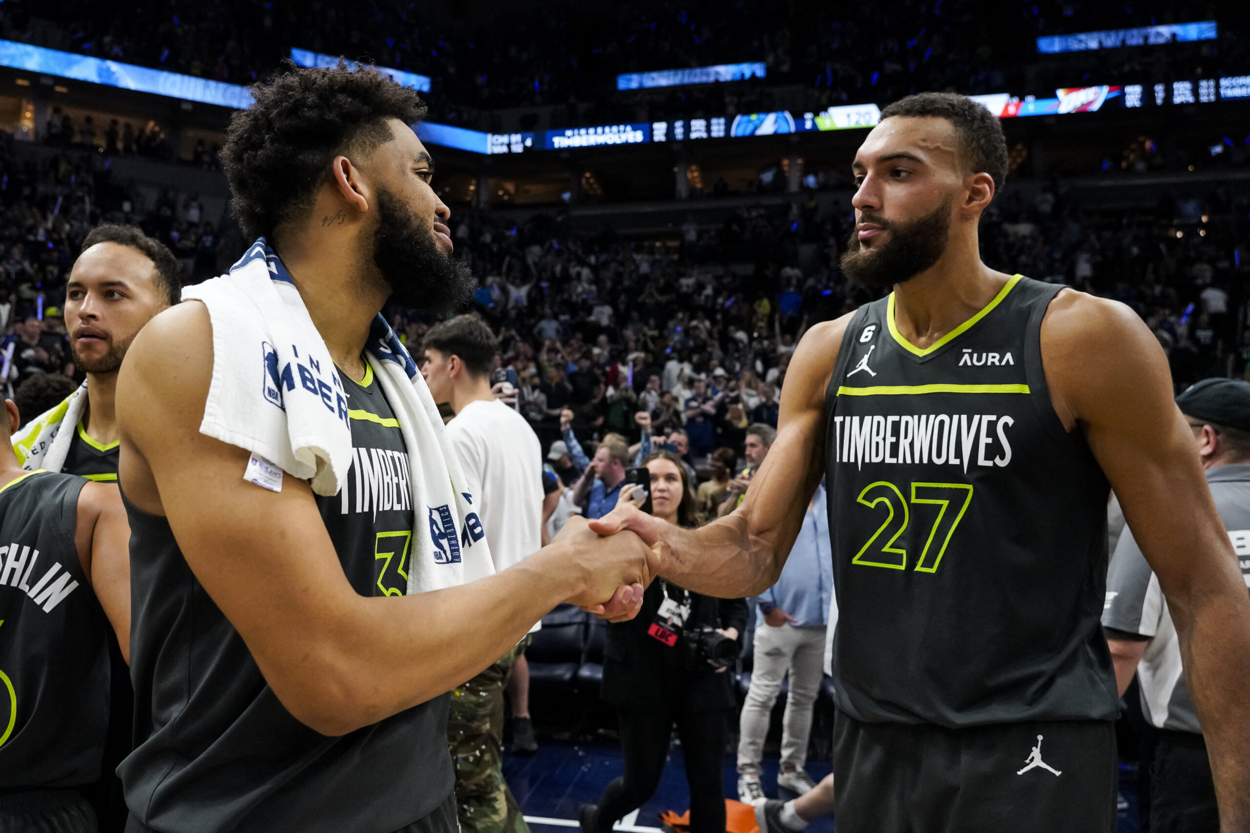 : Karl-Anthony Towns #32 and Rudy Gobert #27 of the Minnesota Timberwolves interact after the NBA Play-In game against the Oklahoma City Thunder at Target Center on April 14, 2023 in Minneapolis, Minnesota