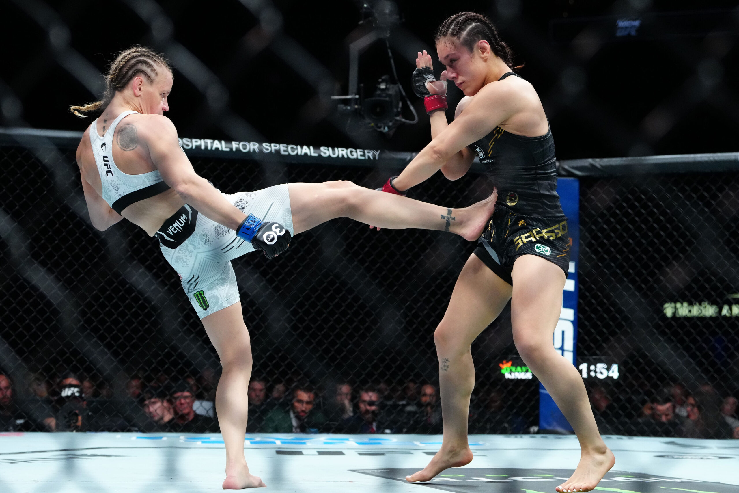 Alexa Grasso (red gloves) fights Valentina Shevchenko (blue gloves) during UFC Fight Night at T-Mobile Arena.